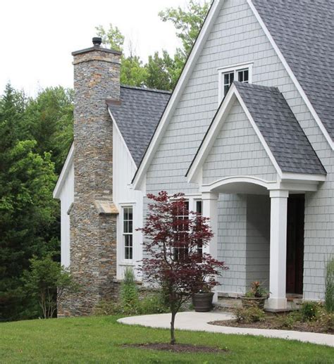 dark grey house with oxblood metal roof|gray roof color combination.